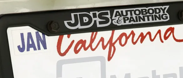 black metal license frame on car