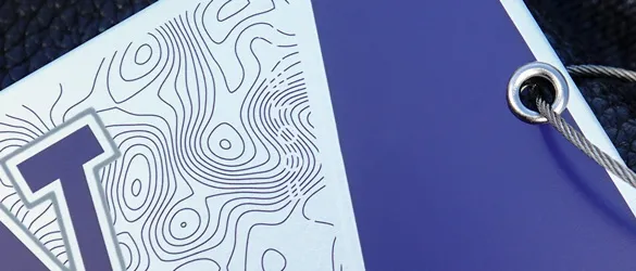 close up of screen printing on metal luggage tag