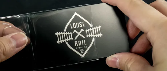 quick black metal card in individual plastic sleeve