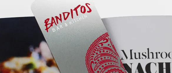 metal bookmark in book with red screen print