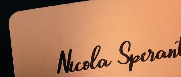 close up of rose gold finish metal card