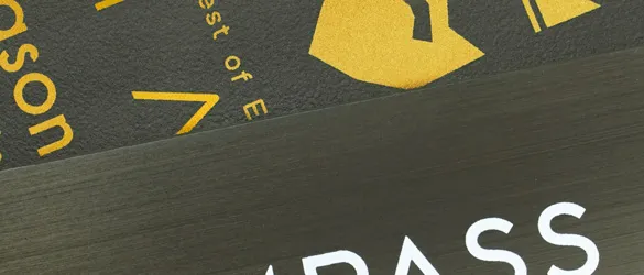 matte black metal business cards in three unique finishes close-up