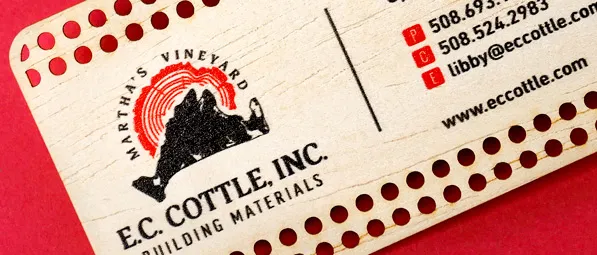 Logo design next to a metal card with the same logo
