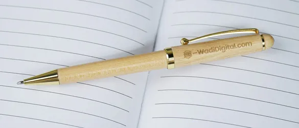 sleek black metal pen aon black background