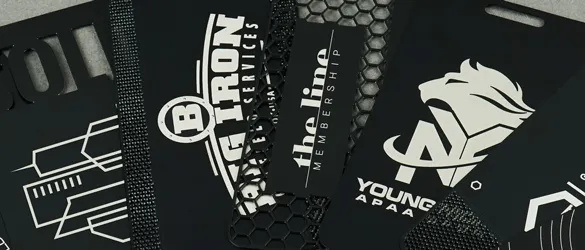 Close Up of differenc quick metal card cutouts with silver laser etching