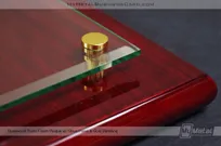Rosewood-Piano-Finish-Plaque-Glass-Panel-Gold-Detail-Closeup