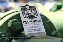 Pulmber logo on a stainless steel metal business card with black spot color