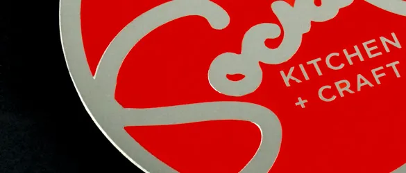 metal business card showing sceren printed red spot color on surface