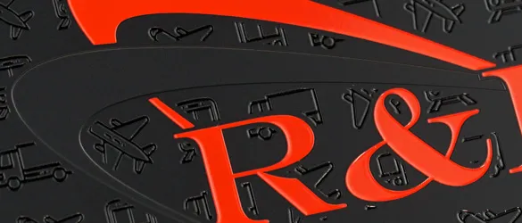 close-up of black metal business card showing surface with screen printed color