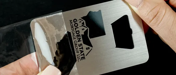 plastic sleeve protecting metal business card bottle opener