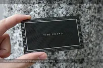 Black-Metal-Business-Card-With-Cutout-Holes-And-Silver-Laser-Etcing