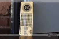 Brass-Finish-Metal-Bookmark-With-Custom-Cutouts-And-Decrorative-R-Logo-Cutout-Pattern