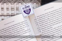 White-Metal-Bookmark-with-Custom-Cutout-For-Volleyball-Camp-with-Purple-Spot-Color