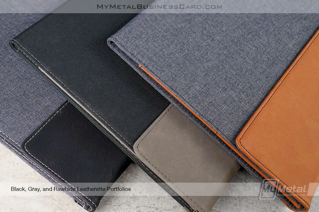 Close-Up-Shot-of-Leatherette-Portfolios-Three-Colors-Black-Gray-Rawhide-Orange